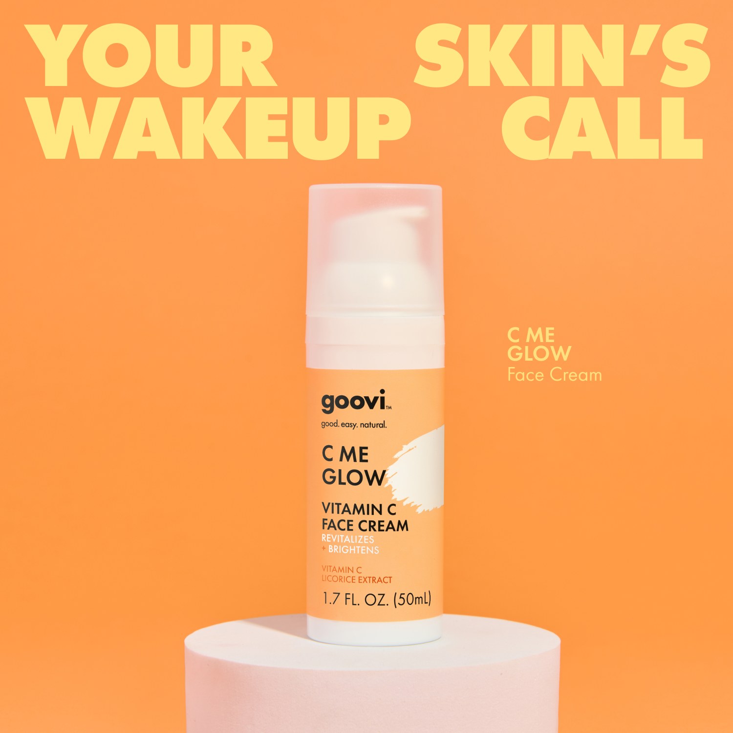 Social post headlined "Your skin's wakeup call" with a Goovi C Me Glow vitamin C face cream pump on a white pedestal, orange backdrop