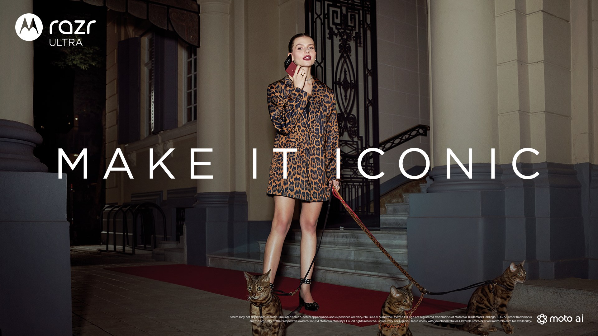 razr ultra key visual "MAKE IT ICONIC": a woman in leopard print on the phone walks three leashed cats